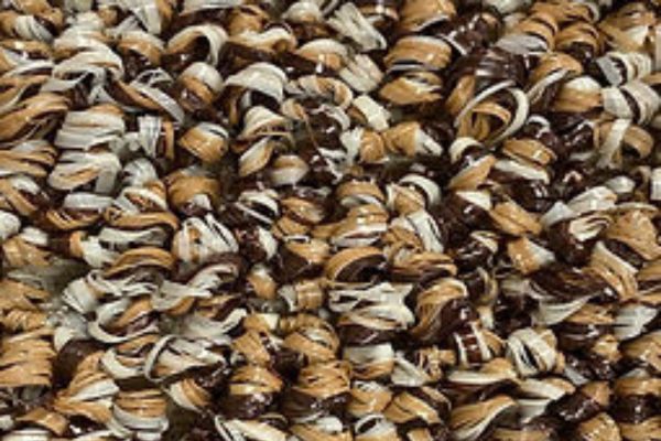 Close up of assorted brown and cream striped seeds or grains